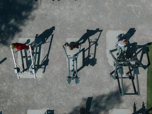 People working out at Laajasalo outdoor gym with Omnigym equipment